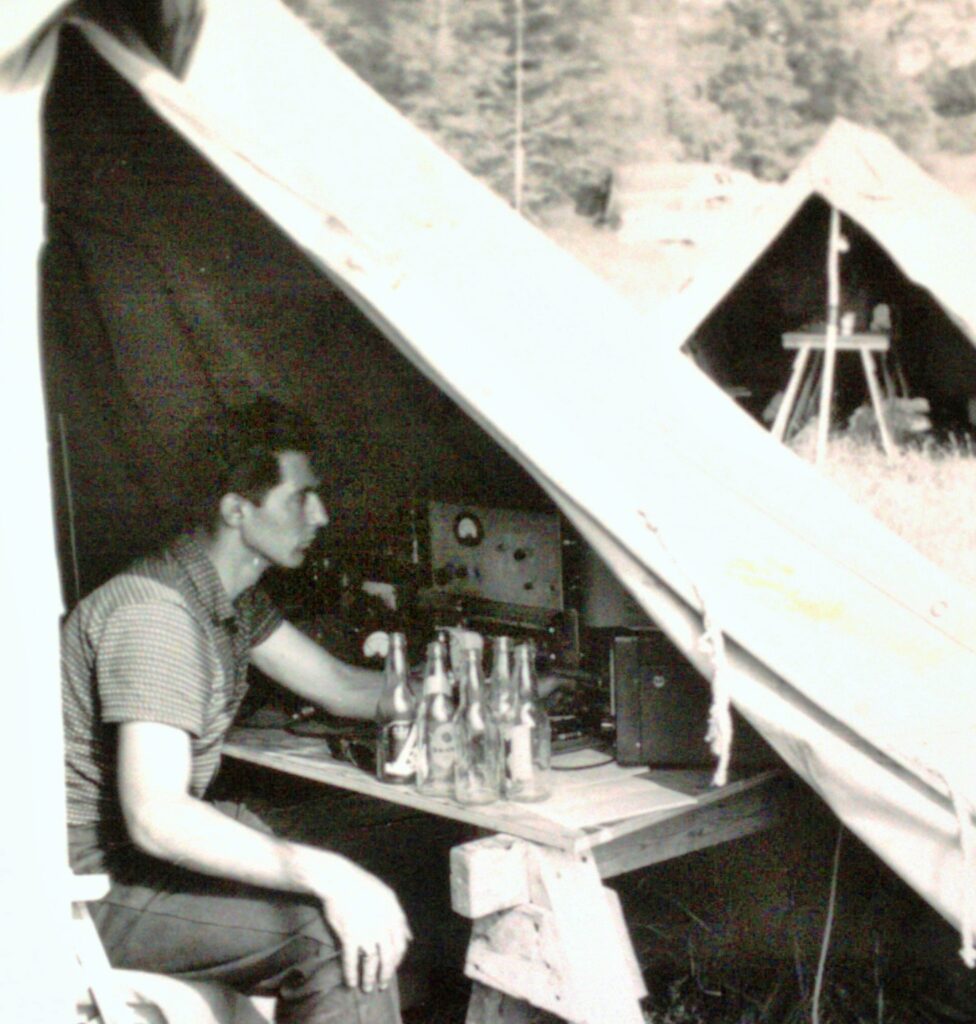 Bill Dmytrasz VE3DNY at the controls of the Skywide VHF Field Day station in 1956. Although the beer bottles are staged, it does make a statement when the band suddenly goes dead and there are no contacts to be made.